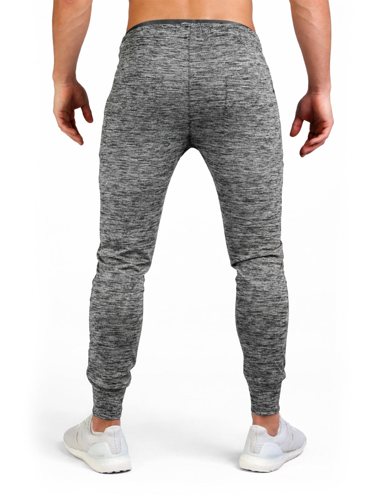 Rückansicht der grauen Gym Hose mit schmal zulaufendem Bein