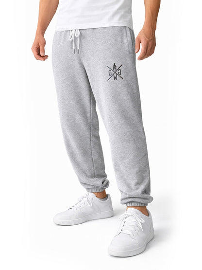 Schräge Ansicht der grauen Jogginghose, Stoff fällt weich über das Knie