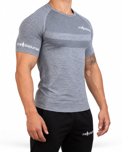 Graues Seamless Sportshirt für Herren von der Seite, mit Raglanärmel und Wabenstreifen an der Flanke